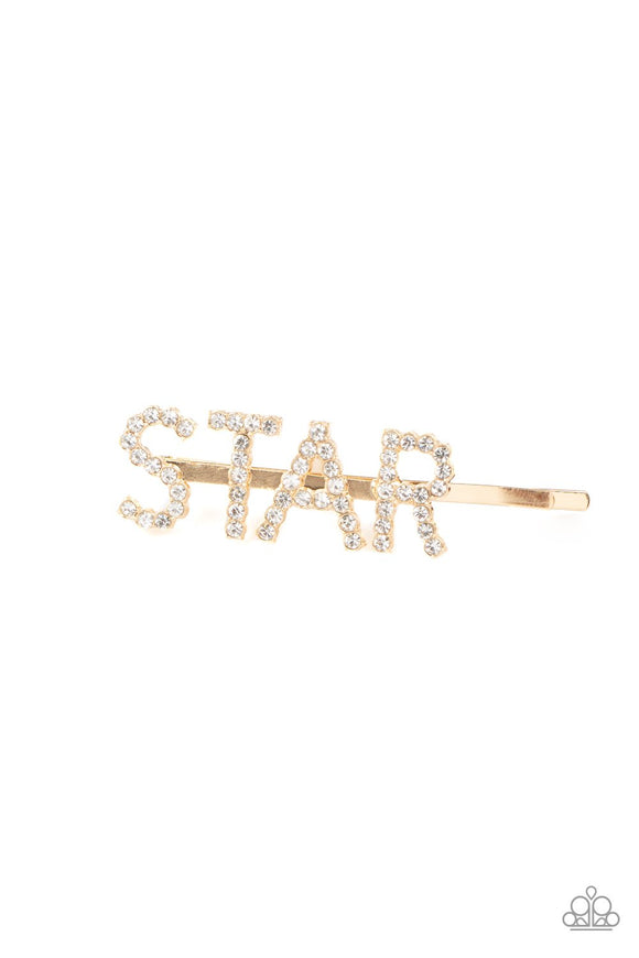 Paparazzi STAR In Your Own Show - Gold - Hair Clip
Encrusted in glittery white rhinestones, glistening gold letters spell out the word, 