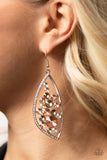 PAPARAZZI SWEETLY EFFERVESCENT - MULTI EARRINGS - A bubbly collection of peach, white, and golden rhinestones coalesce inside an asymmetrical silver frame. One side of the frame is encrusted in glassy white rhinestones, adding a refined flair to the bubbly lure. Earring attaches to a standard fishhook fitting.