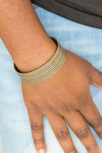 Paparazzi Absolute Amazon - Brass Bracelet - Stamped in tribal-inspired patterns, an antiqued brass cuff wraps around the wrist for an indigenous look.