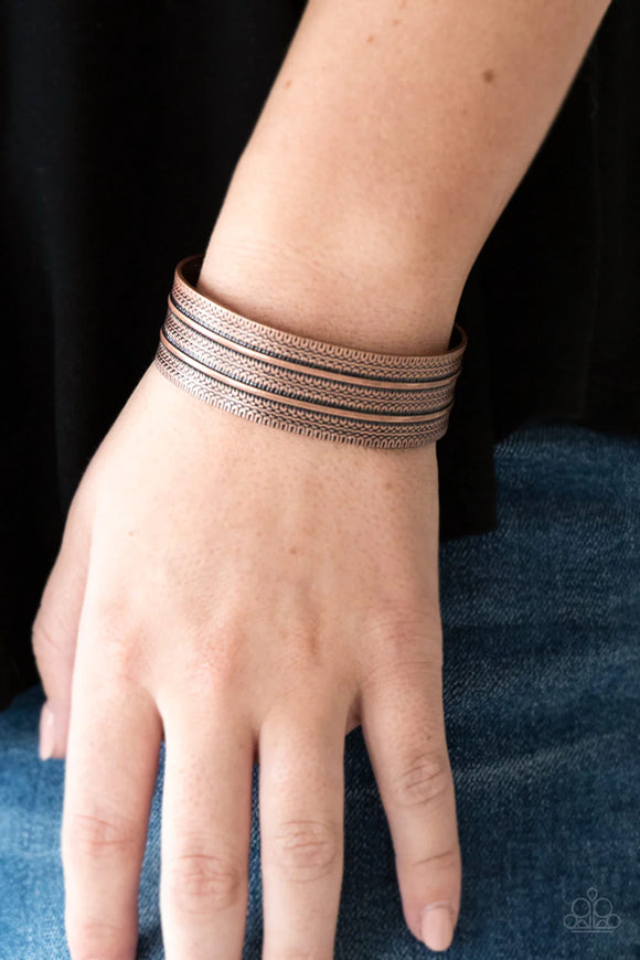 Paparazzi Absolute Amazon - Copper Bracelet - Stamped in tribal inspired patterns, an antiqued copper cuff wraps around the wrist for an indigenous look.