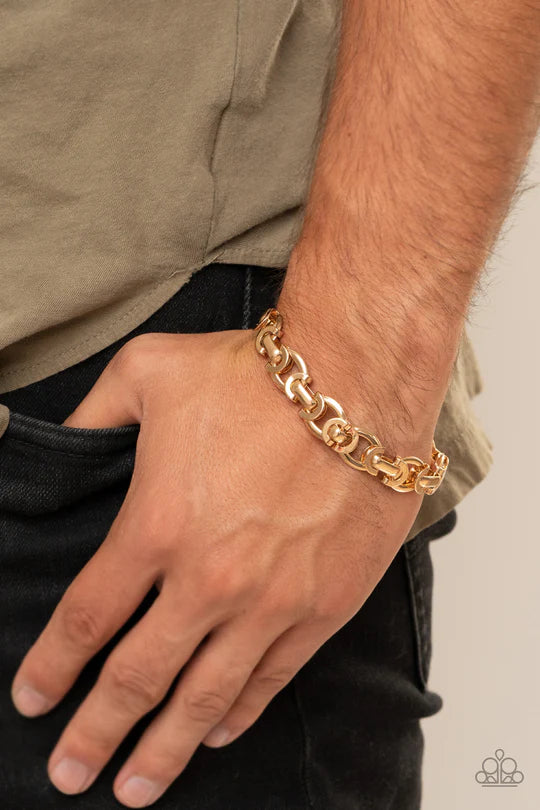 Paparazzi Advisory Warning - Gold Bracelet - An array of chunky gold links connect across the wrist for a bold chain look. Features an adjustable clasp closure.