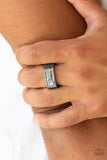 Paparazzi Atlas - Black Gunmetal Ring - A glassy white rhinestone is pressed into the corner edge of a geometric stamped rectangular gunmetal frame. Features a stretchy band for a flexible fit.