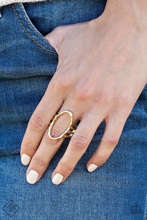 Paparazzi Center Chic - Gold Ring - Delicately hammered in shimmery detail, a warped gold oval sits atop an airy gold band for an artisanal look. Features a stretchy band for a flexible fit.