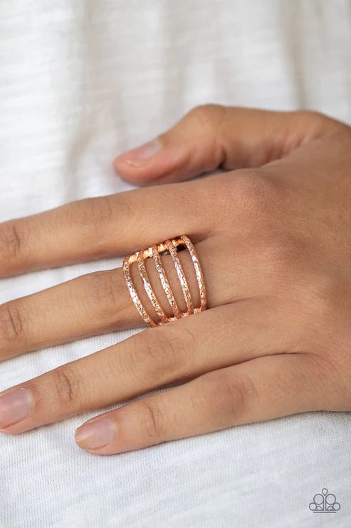 Paparazzi Classic Sheen - Rose Gold Ring - Delicately hammered in endless shimmer, glistening rose gold bands stack across the finger, creating an airy frame. Features a stretchy band for a flexible fit. 