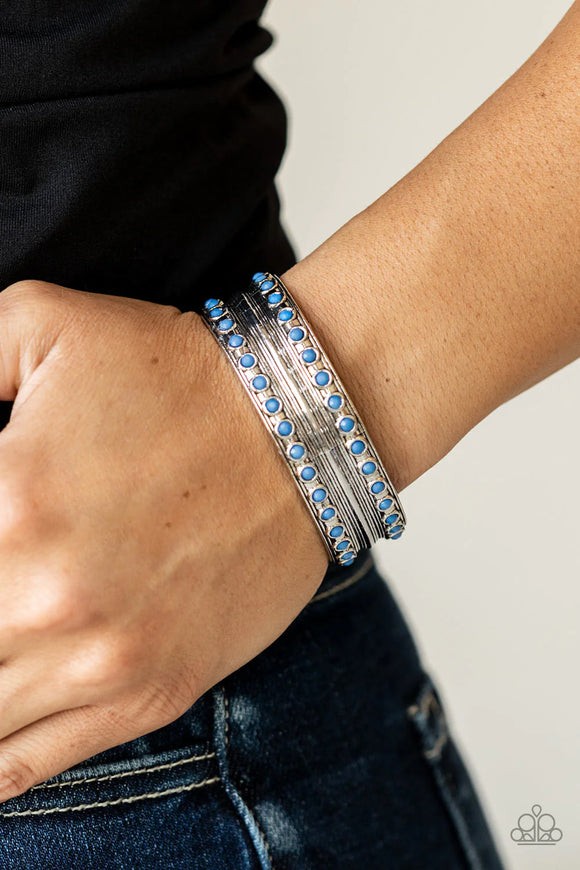 Paparazzi Costa Rica Retreat - Blue Bracelet - Etched and embossed in stacks of linear texture, an antiqued silver cuff is bordered in rows of faceted Spring Lake beads for a refreshing finish.