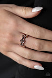 Paparazzi Daisy Dapper - Copper Ring - A row of dainty copper daisies connect across the finger, coalescing into a whimsical band. Features a dainty stretchy band for a flexible fit.