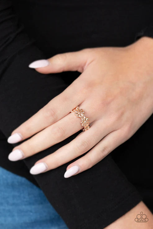 Paparazzi Daisy Dapper - Rose Gold Ring - A row of dainty rose gold daisies connect across the finger, coalescing into a whimsical band. Features a dainty stretchy band for a flexible fit.