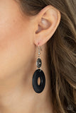 Paparazzi Earthy Epicenter - Black Earrings - A large black stone ring dangles from an antiqued silver disc, accented with raised dots in concentric circles. The timeless combination of stone and silver and the intricate textures bring an undeniably artisan feel to the piece. Earring attaches to a standard fishhook fitting.