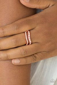 Paparazzi Elite Squad - Copper Ring - Varying in size, glittery white rhinestones are encrusted along waving shiny copper bands for a refined look. Features a dainty stretchy band for a flexible fit