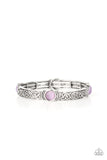 Paparazzi Ethereally Enchanting - Purple Bracelet - A purple cat's eye stone is pressed into a round frame at the end of a silver bar. Embossed with a whimsical vine motif, the patterned bars are threaded on stretchy bands to repeat around the wrist for an enchanting finish.