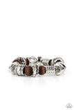 Paparazzi Exploring The Elements - Brown Bracelet - Stamped, studded, and embossed in tribal inspired patterns, a collection of chunky silver beads join earthy wooden beads along a stretchy band around the wrist for an earthy flair.