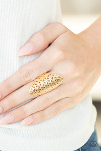 Paparazzi FRILL Ride - Gold Ring - Glistening gold filigree crisscrosses and swirls into a striking floral pattern across the finger, creating a seasonal shimmer. Features a stretchy band for a flexible fit.