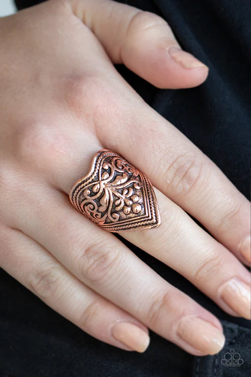 Paparazzi Fall Into VINE - Copper Ring - Embossed in vine-like patterns, a triangular copper frame folds around the finger for a bold tribal look. Features a stretchy band for a flexible fit.
