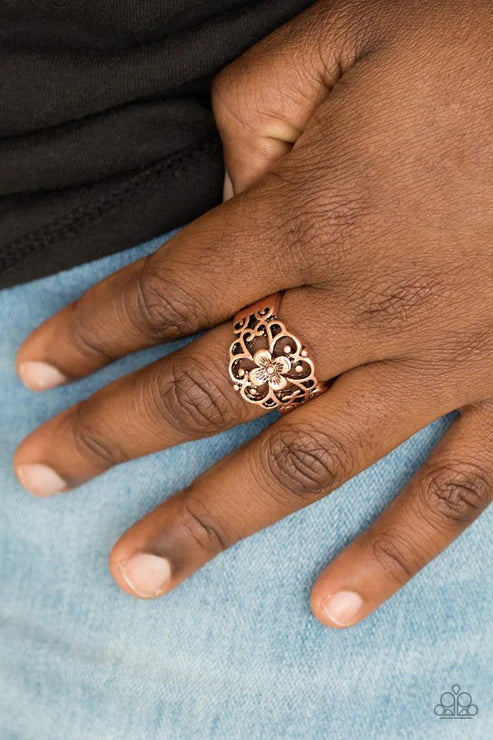 Paparazzi Fanciful Flower Gardens - Copper Ring - Glistening copper filigree blooms from a shimmery floral center, creating a whimsical band across the finger. Features a stretchy band for a flexible fit.