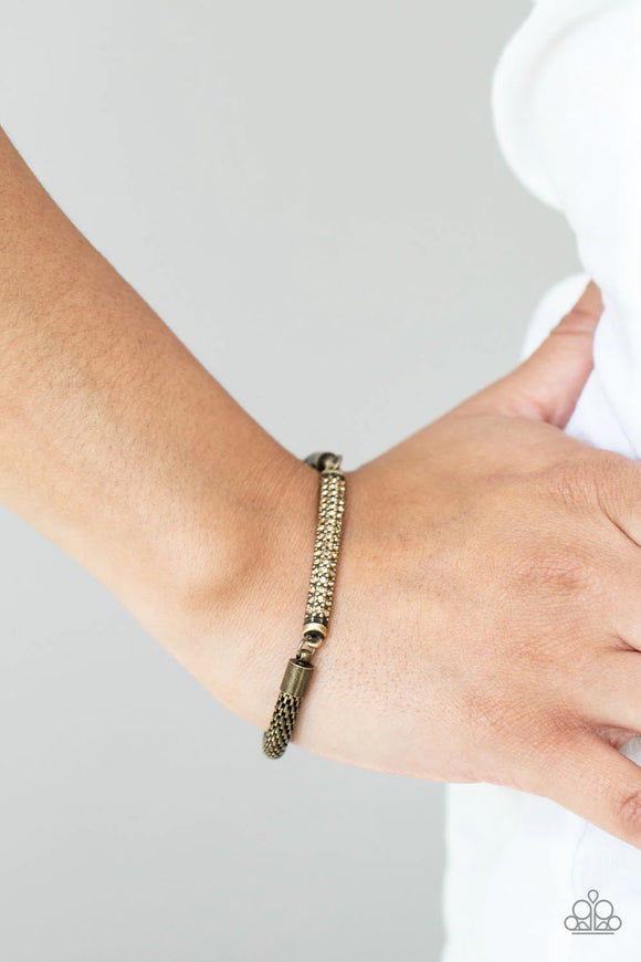 Paparazzi Fearlessly Unfiltered - Brass Bracelet - Threaded along a stretchy band, a gritty strand of rounded brass mesh chain links with a smoldering brass plate encrusted in rows of dainty topaz rhinestones, creating an edgy shimmer around the wrist.
