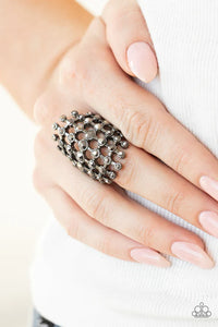 Paparazzi Fiercely Flashy - Black Gunmetal - Ring - Featuring glistening gunmetal fittings, a sparkly series of hematite rhinestones interlock into an edgy grid across the finger for a spellbinding look. Features a stretchy band for a flexible fit.