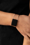 Paparazzi Free Expression - Black Bracelet - Black suede cording wraps around a silver fitting nestled between an airy silver cuff, creating a colorfully rustic centerpiece.