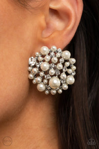 Paparazzi Head To Toe Twinkle - White Clip-On Earrings - A bubbly collection of timeless pearls and glassy white rhinestones coalesce into an oversized circular frame, creating a sparkly statement. Earring attaches to a standard clip-on fitting.