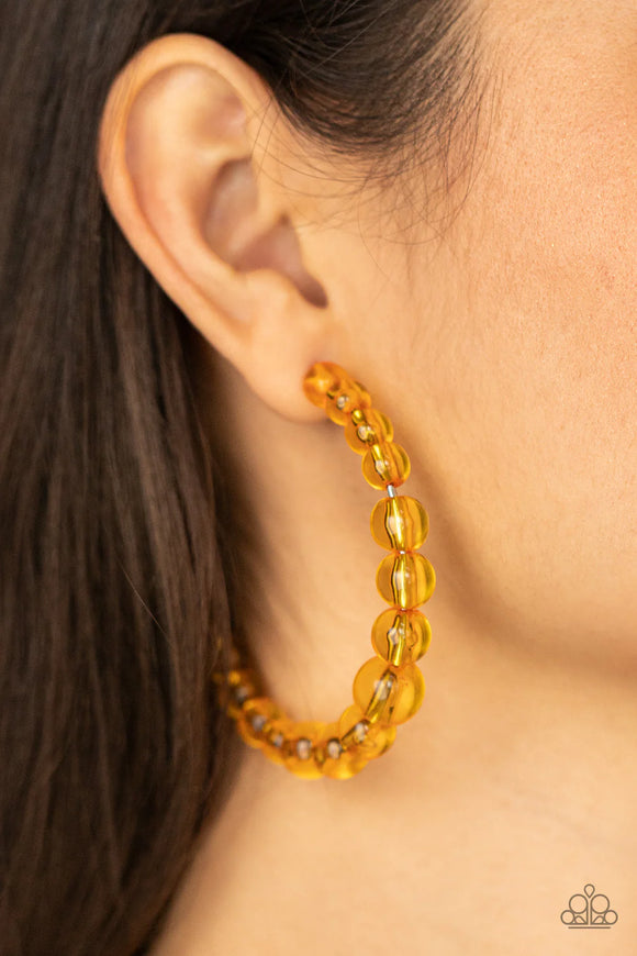 Paparazzi In The Clear - Orange Earrings - Gradually increasing in size at the center, a glassy collection of Marigold beads are threaded along an oversized hoop for a bubbly effect. Earring attaches to a stand post fitting. Hoop measures approximately 2 1/2
