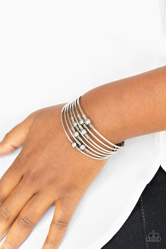 Paparazzi Industrial Intricacies - Silver Bracelet - Held in place by silver wire fittings, classic silver beads haphazardly dot dainty silver bars that connect into a layered cuff around the wrist.