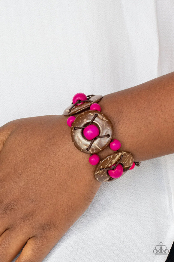 Paparazzi Island Adventure - Pink Bracelet - An oversized collection of pink wooden beads and distressed brown wooden discs are threaded along stretchy bands that decoratively weave around the wrist for a summery flair.