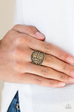 Paparazzi Island Rover - Brass Ring - Studded and zigzagging textures are embossed across the front of a thick brass band for a tribal flair. Features a stretchy band for a flexible fit.