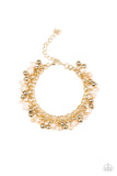Paparazzi Just For The FUND Of It - Gold Bracelet - Dipped into a golden metallic shimmer, faceted white beads and classic gold beads swing from interlocking gold chains, creating a refined fringe around the wrist. Features an adjustable clasp closure.