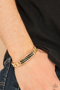 Paparazzi Keep Your Guard Up - Gold Bracelet - Gold chain-like bars attach to a riveted gold centerpiece, creating a statement-making cuff around the wrist.