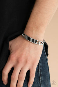 Paparazzi Keep Your Guard Up - Silver Bracelet - Silver chain-like bars attach to a riveted silver centerpiece, creating a statement-making cuff around the wrist.