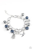 Paparazzi Lady Love Dove - Blue Bracelet - Blue pearls, ornate silver beads, and white rhinestone encrusted accents swing from a dramatic silver chain. A shimmery silver bird charm and silver tassel are added to the display, creating a whimsical fringe around the wrist. Features an adjustable clasp closure.