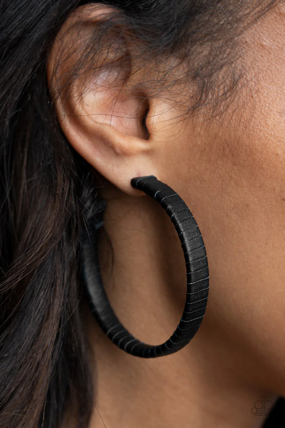 Paparazzi Leather Clad Legend - Black Earrings - A black leather lace wraps around a thick silver hoop, creating an edgy display. Earring attaches to a standard post fitting. Hoop measures approximately 2 1/2