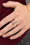 Paparazzi Make A SHEEN - Copper Ring - Dainty white rhinestones are sporadically sprinkled across rows of shiny copper bands abstractly layered across the finger for a refined twist. Features a stretchy band for a flexible fit.