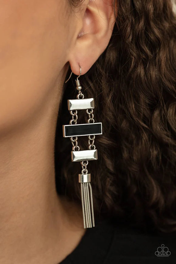 Paparazzi Mind Body And SEOUL - Black Earrings - Glistening silver rectangular frames link with a black rectangular frame, connecting into a sleekly stacked lure. A shimmery silver tassel dances from the bottom, adding a hint of whimsicality to the colorful display. Earring attaches to a standard fishhook fitting.