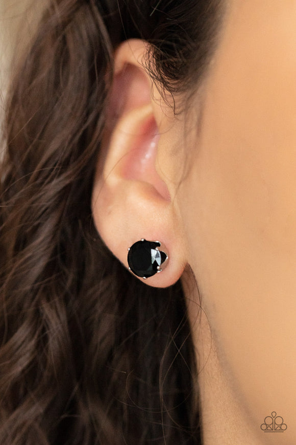 Paparazzi Modest Motivation - Black Earrings - An oversized black rhinestone is nestled inside a pronged silver fitting, creating a timeless statement piece. Earring attaches to a standard post fitting.