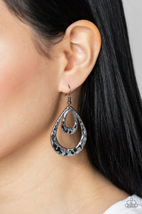 Paparazzi Museum Muse - Black Gunmetal Earrings - Hammered gunmetal teardrops join into an edgy layered lure, creating an intense industrial display. Earring attaches to a standard fishhook fitting.
