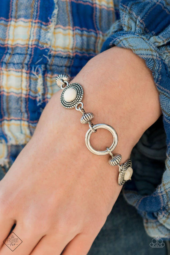 Paparazzi Musical Mountains - White Bracelet - Featuring an airy silver hoop centerpiece, a rustic collection of silver beads and silver discs dotted in white stones delicately link around the wrist for a seasonal look. Features an adjustable clasp closure.
