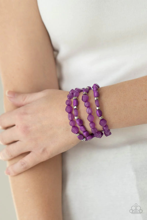Paparazzi Nice GLOWING - Purple Bracelet - Bright purple irregular shaped beads in varying opacities, accented with shining faceted silver beads are threaded along stretchy bands and stack up the wrist for a glowing display.