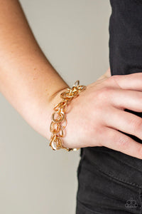 Paparazzi Noise Control - Gold Bracelet - Countless gold rings dangle from a shimmery gold chain, creating a noisy fringe around the wrist. Features an adjustable clasp closure.