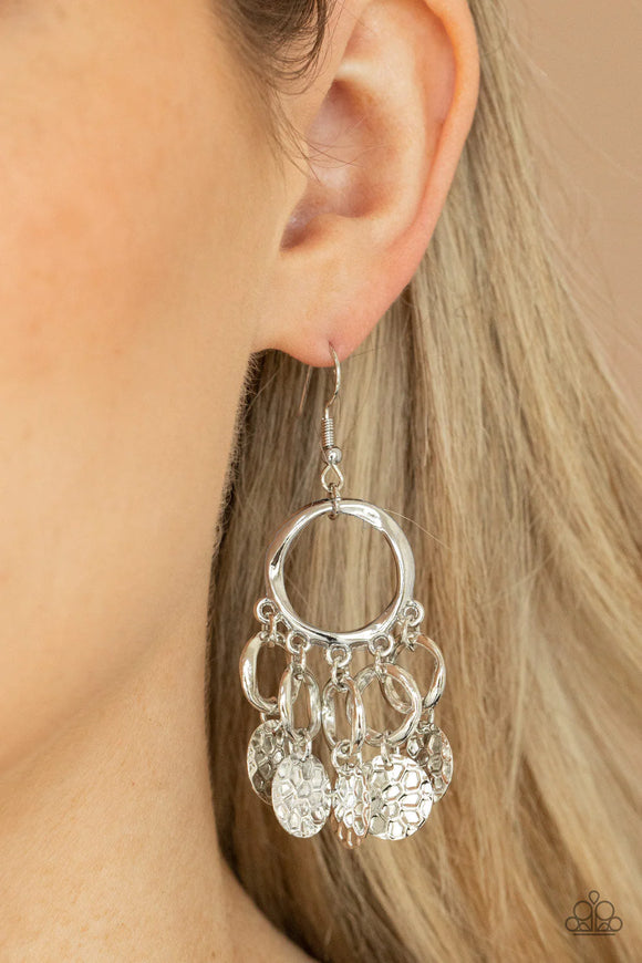 Paparazzi Partners In CHIME - Silver Earrings - Embossed in tactile geometric patterns, shiny silver discs swing from the bottom of dainty silver rings at the bottom of an asymmetrical silver ring for a noise-making fashion. Earring attaches to a standard fishhook fitting.