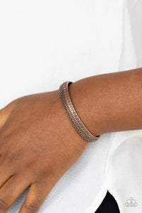 Paparazzi Peak Conditions - Copper Bracelet - Embossed and studded in geometric patterns, an antiqued copper cuff curls across the wrist for a dainty look.