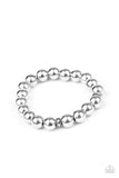 Paparazzi Resilience - Silver Bracelet - Infused with dainty silver accent pieces, a collection of oversized silver beads are threaded along a stretchy band around the wrist for a causally urban look.