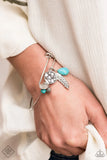 Paparazzi Root And RANCH - Blue Bracelet - Featuring a shimmery silver feather charm, ornate silver beads and earthy turquoise stone beads glide along the fitted center of a dainty silver bangle-like bracelet for a whimsically charming look.