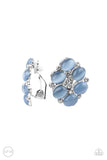 Paparazzi Row Row Row Your Yacht - Blue Clip-On Earrings - A glassy collection of dainty white rhinestones and Cerulean cat's eye stones coalesce into a bubbly frame for a timeless look. Earring attaches to a standard clip-on fitting.