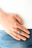 Paparazzi Rural Relic - Copper Ring - Embossed in shimmery filigree, glistening copper frames join around a refreshing white stone center for a seasonal look. Features a stretchy band for a flexible fit.