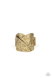Paparazzi Scandalous Shimmer - Brass Ring - Encrusted in row after row of glittery aurum rhinestones, dazzling brass bands overlap atop the finger, creating a glamorously stacked frame. Features a stretchy band for a flexible fit.