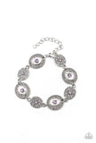 Paparazzi Secret Garden Glamour - Purple Bracelet - Delicate Amethyst Orchid rhinestones dot the centers of engraved antiqued silver discs. The dotted textures and heart shaped vines create a charming impression as they gracefully link around the wrist. Features an adjustable clasp closure.