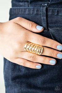 Paparazzi Sound Waves - Gold Ring - Delicately hammered gold bands ripple across the finger, stacking into a boldly layered look for an edgy industrial finish. Features a stretchy band for a flexible fit.