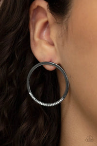 Paparazzi Spot On Opulence - Black Gunmetal Earrings - As if dipped in glitter, the bottom of a flat gunmetal hoop is encrusted in dainty white rhinestones for a classic shimmer. Earring attaches to a standard post fitting.
