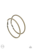 Paparazzi Subtly Sassy - Brass Clip-On Earrings - An oversized brass hoop featuring a porous-like texture sends off a subtle shimmer as it wraps around the ear. Earring attaches to a standard clip-on fitting. Hoop measures approximately 2" in diameter.