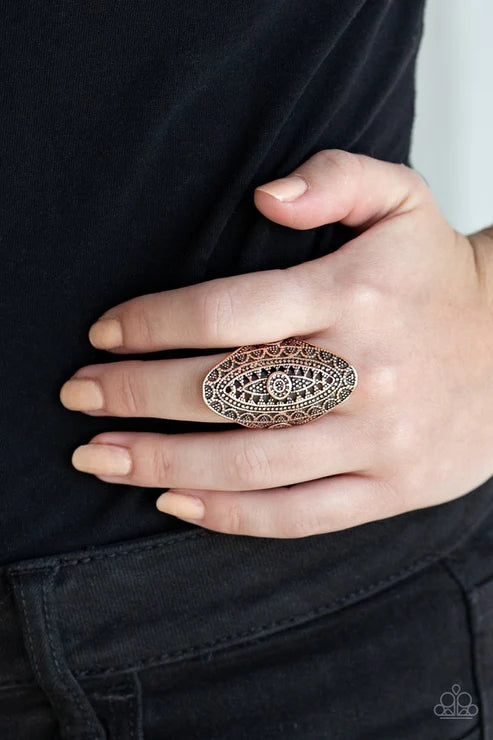 Paparazzi TRIBAL And Tribulation - Copper Ring - Radiating with studded filigree, an ornate copper oval folds around the finger for a bold tribal look. Features a stretchy band for a flexible fit.